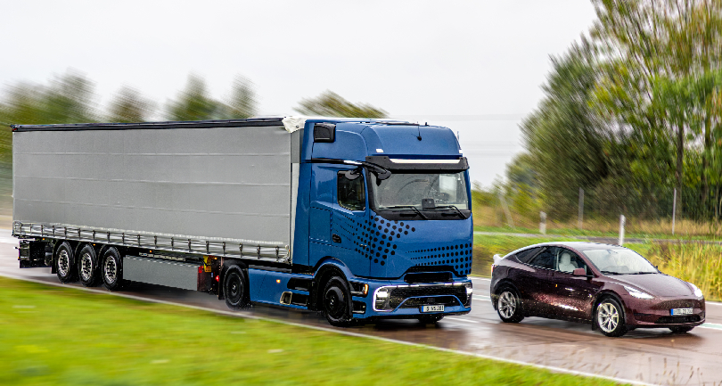 A specialized car carrier transport truck moving vehicles across an Indian highway.